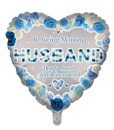 18″ Heart In Loving Memory Husband Remembrance Foil Balloon shaped like a heart with a border of blue and white roses, reading In Loving Memory HUSBAND Dearly Loved And Remembered.
