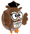 The 28" Multi-Sided Grad Owl Foil Balloon by Betallic features a brown owl with big eyes, glasses, a black graduation cap, and "Congrats Grad!" in colorful letters on its chest.