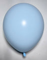 A single 18″ Deco Fade Blue Decomex Latex Balloon from Decomex, inflated and tied, rests on a plain, light-colored surface.