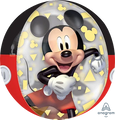 The 16" Mickey Mouse Forever Orbz Clear Foil Balloon by Anagram/MD features a cheerful Mickey in red shorts, white gloves, and yellow shoes with yellow geometric shapes and Mickey icons, plus the Anagram logo in the corner.