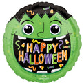 The 18" Haunted Manor Monster Foil Balloon by Anagram/MD features a round green monster face with "Happy Halloween" in colorful letters, plus candy and confetti decorations on a black background inside the mouth.