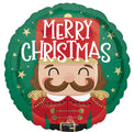 The Anagram/MD 18" Nutcracker Workshop Christmas Foil Balloon features a smiling cartoon nutcracker in red and green with gold details and “Merry Christmas” in bold white text above.