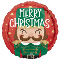 The Anagram/MD 18" Nutcracker Workshop Christmas Foil Balloon features a mustached nutcracker in a green uniform with gold accents and "Merry Christmas" in white, surrounded by gold stars on a round red foil background.