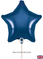 A 9" navy blue star-shaped Oaktree foil balloon (air-fill only, self-sealing valve, 5 per pack) is shown on a white background. Text reads “Balloon cup & stick not included.” A small UK flag appears in the lower right corner.