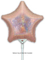A holographic rose gold star-shaped foil balloon (9", airfill only, self-sealing valve) by Oaktree is shown. Balloon is attached to a cup and stick holder. Text reads: Balloon Cup & Stick Not Included. 5 per pack.
