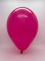 A single TT-260's Hot Pink Tuftex Latex Balloon floats against a plain white background.