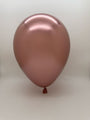 A single 5'' Balloonia Latex Balloons Professional Line Brilliant Rose Gold balloon from Balloonia (100 per bag) is inflated and floating against a plain white background.