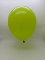 A single Balloonia 160BN Professional Line Lime Green Twisting Latex Balloon (from a 100-pack) floats against a plain, light background, ideal for professional balloon artists and modelling.