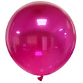 A large, shiny, round Cattex 36″ Crystal Fuchsia latex balloon with a small knotted end at the bottom and light reflections on its surface, floating against a white background.