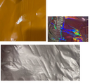 Betallic 18" (233 Balloons) Solid Color Foil Balloons, slightly damaged at $0.12 each: one solid orange, one rainbow iridescent, and one metallic silver. Each has shiny, reflective surfaces and visible wrinkles.
