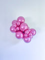 A set of Tuftex 36" Rockstar Chrome Like Effects latex balloons (2 per bag) in shiny metallic pink is grouped together against a plain white background.